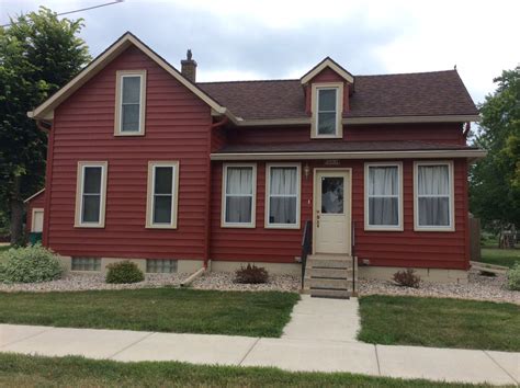 brown house green metal roof|reddish brown roof house colors.